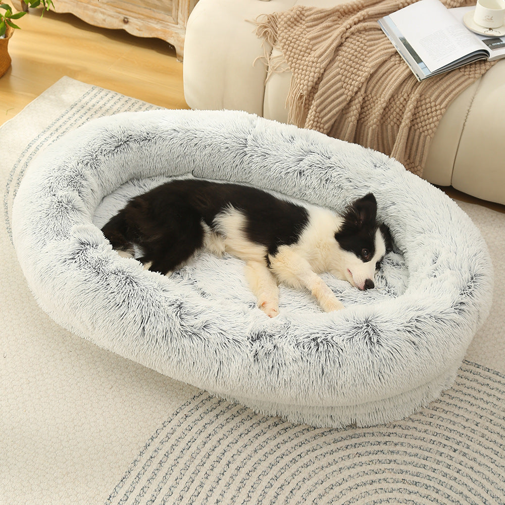 Washable Oval Donut Pet Bed shown in a home setting