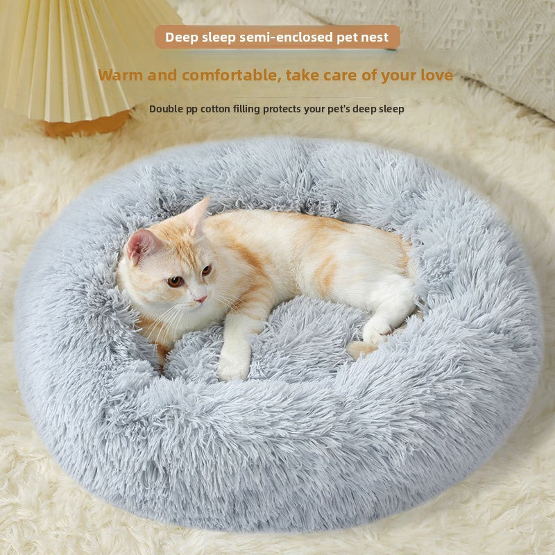 Round Donut Plush Pet Bed shown in a home setting (view 2)
