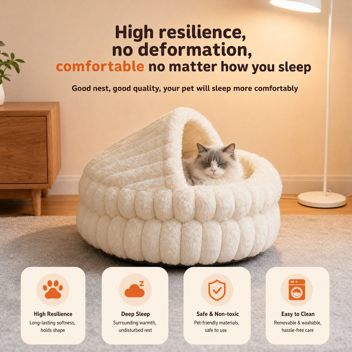 A ragdoll cat sitting in the cream hooded cave bed in a living room