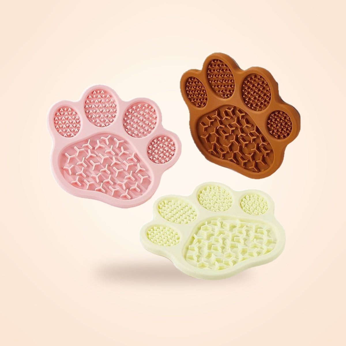 Paw-Shaped Silicone Lick Mats in pink, brown and cream