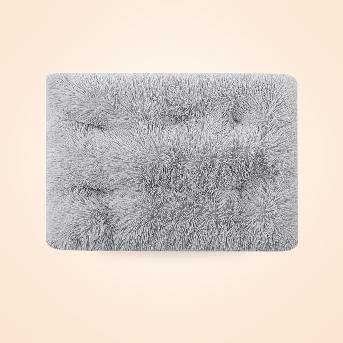 Grey shag plush crate pad laid flat, on a warm cream background