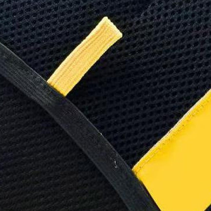 Close-up of the elastic hand strap and yellow pull tab across the back of the mitt