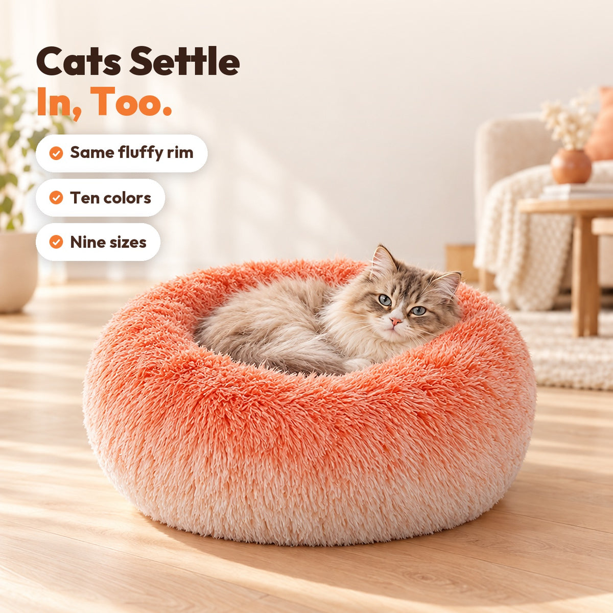 Long-haired cat settled in the orange gradient donut plush pet bed