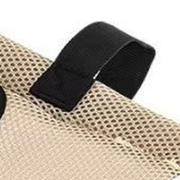 Close-up of a hook-and-loop strap loop at the edge of the mesh bed