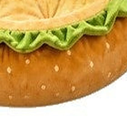 Close-up of the sesame-speckled bun-coloured outer wall