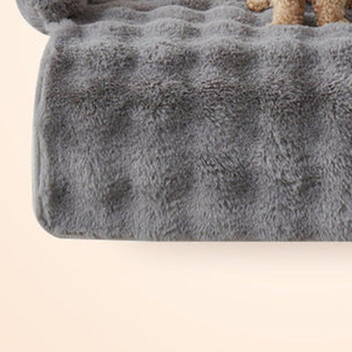 Close-up of the raised bolster rim on the plush pet bed