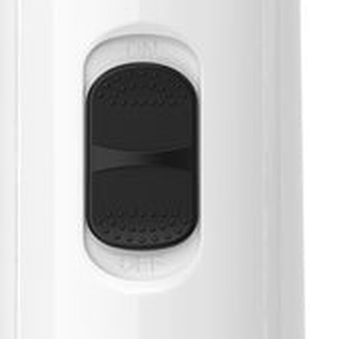 Close-up of the grinder's textured oval power button