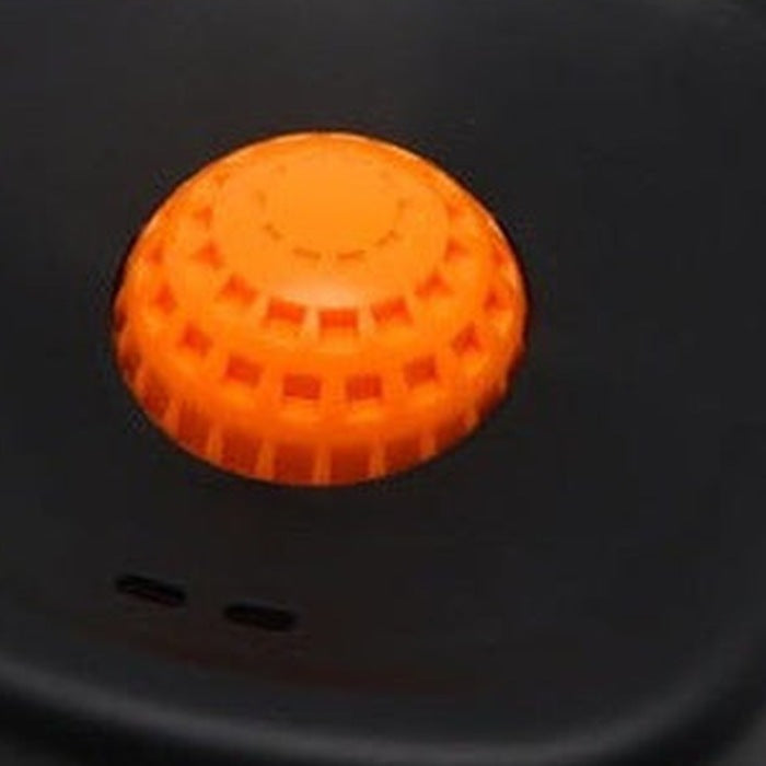 Close-up of the ridged rolling ball seated in the top of the bowl