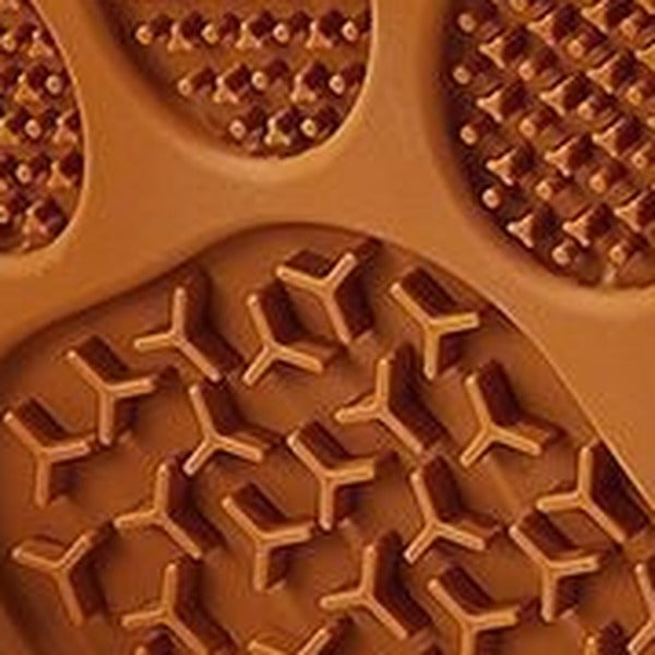 Close-up of two different raised textures on the brown mat