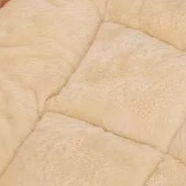 Close-up of the tufted quilting that holds the filling in place