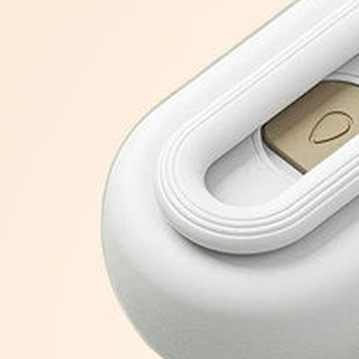 Close-up of the loop handle on the mist grooming brush