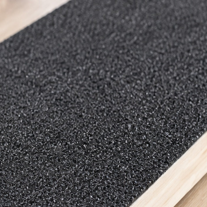 Close-up of the scratch board's gritty abrasive surface