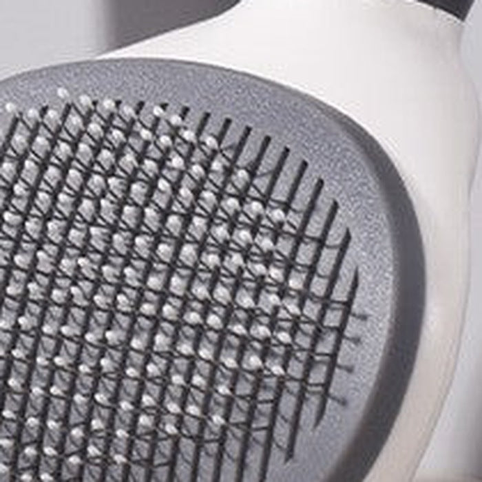 Close-up of the brush's bed of fine ball-tipped wire pins